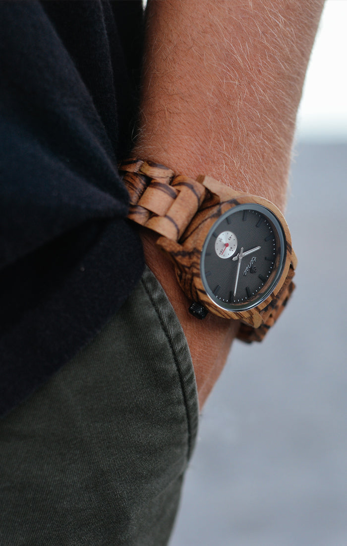 Hampton Custom zebrawood wooden watch with black dial on wrist — Tense Watches Canada